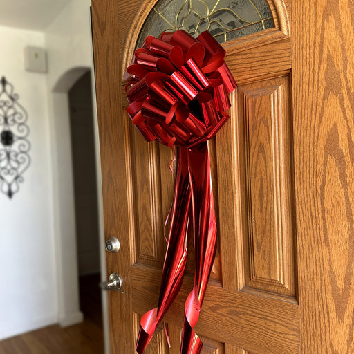 big  shiny red bow on a door