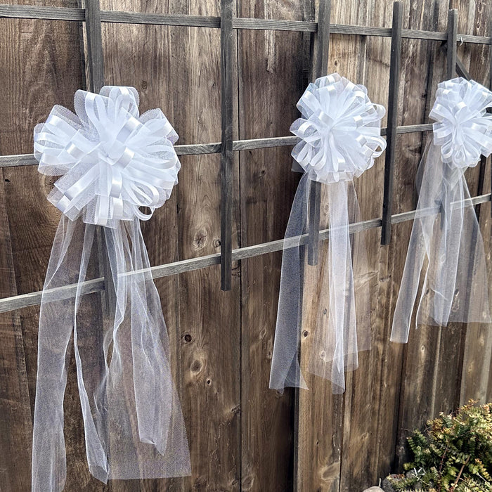 large white wedding church aisle bow