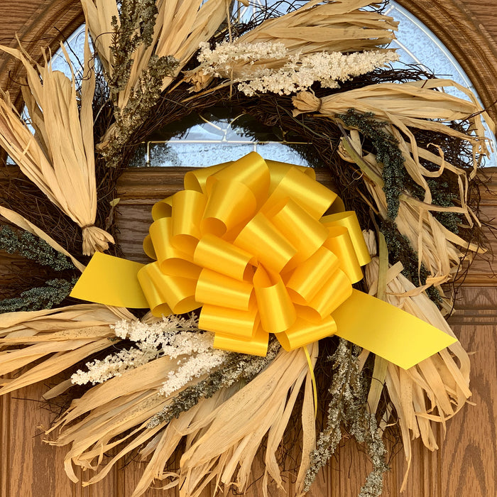 large yellow wreath bows